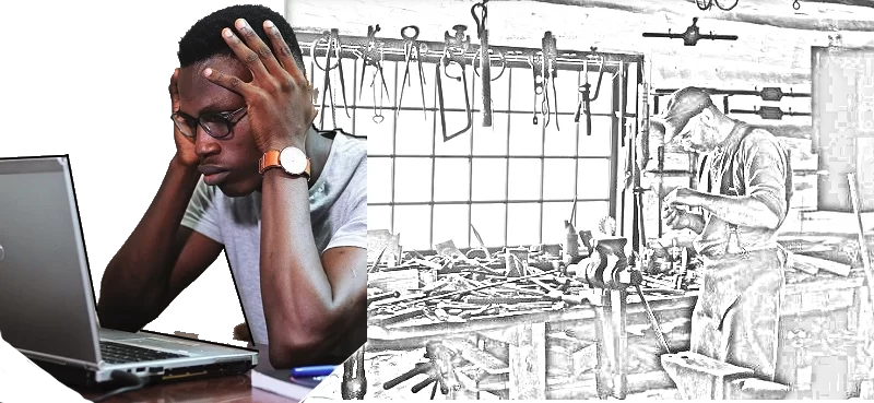 Man sits with his elbows on the table in front of him and his hands holding each side of his head while he looks at his laptop. His expression appears sad or mildly frustrated. Behind him are drawings of various hand tools used to fix and build things, including saws, planers, compasses and clamps.